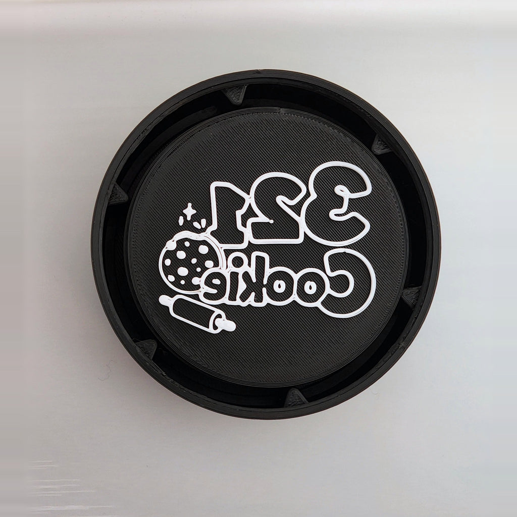 12-Disc Case from directly above with a white 321 Cookie logo disc inside