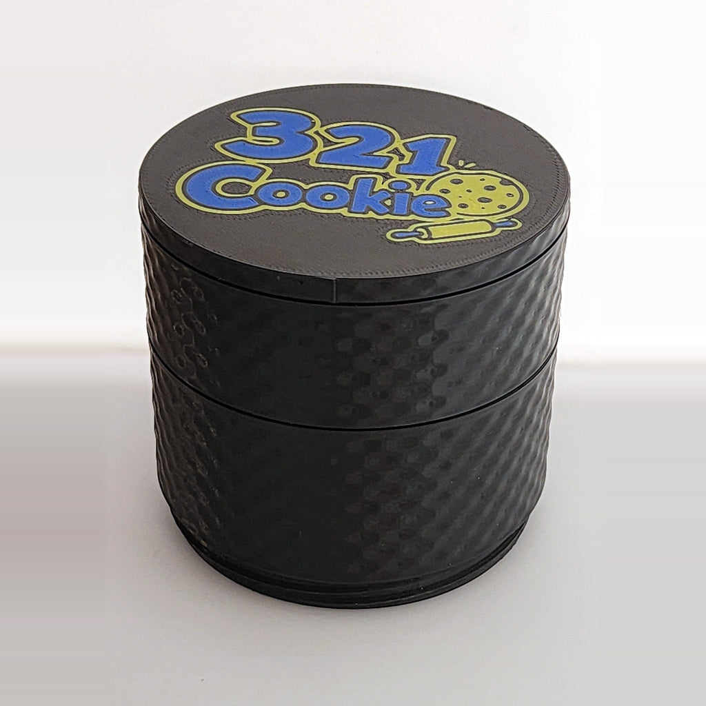 The Storage Stack included in every set: press case and 12-disc case topped with the 321 Cookie logo lid