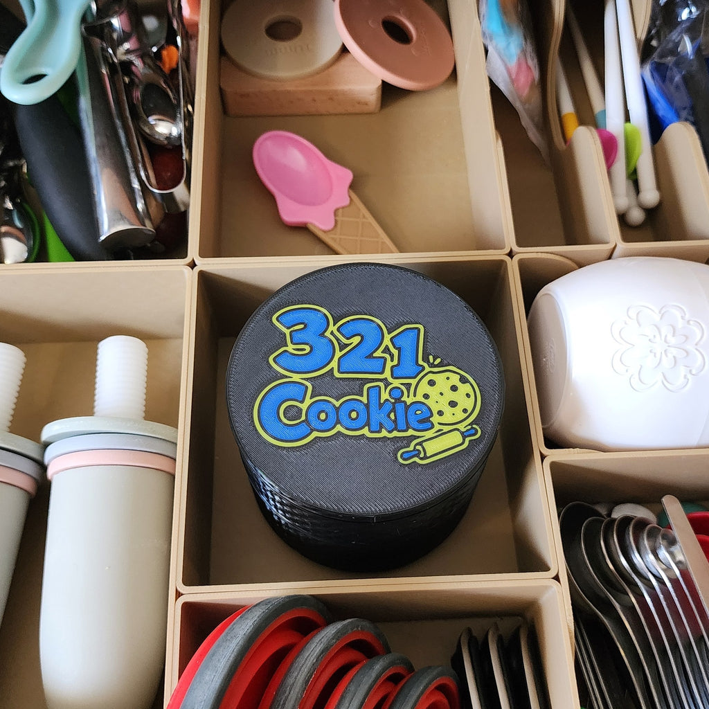 Storage Stack sitting in a compartment of a kitchen drawer, seen from above