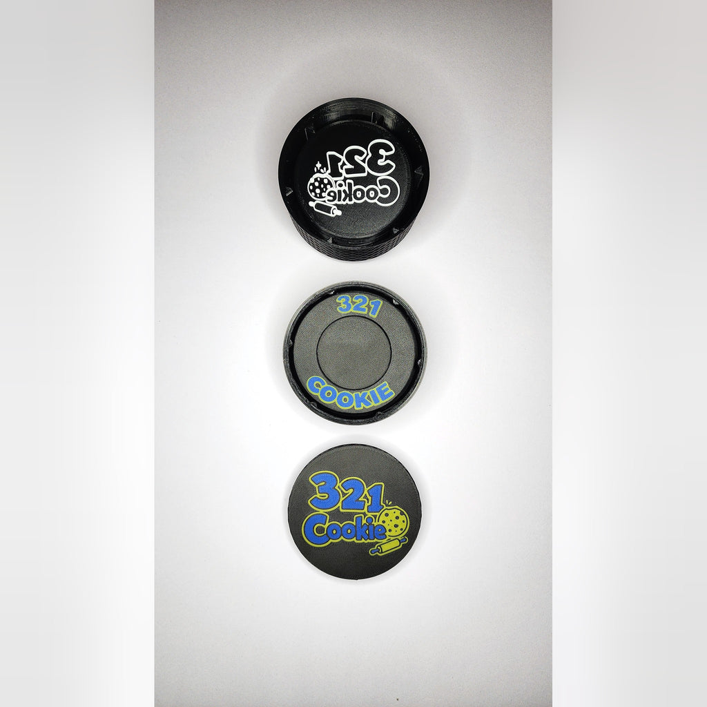 The three Storage Stack parts lined up from above: the 12-disc case, the press case and the full-color logo lid