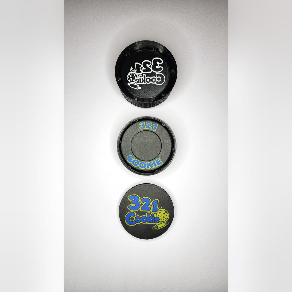 The Storage Stack parts lined up from above: the 12-disc case, the press case and the full-color logo lid